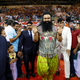 Gurmeet Ram Rahim Singh Ji Insan, centre, greets his followers ahead of the release of his movie “MSG, The Warrior Lion Heart,” in New Delhi.